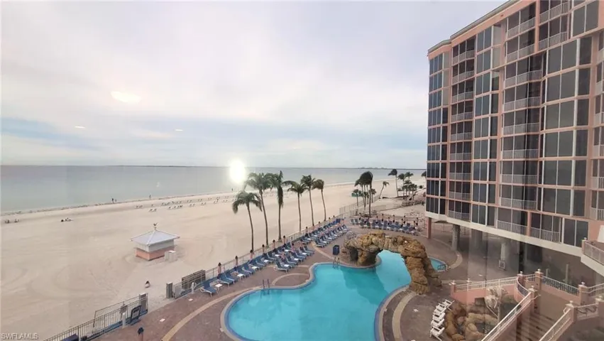 Community pool featuring a water view