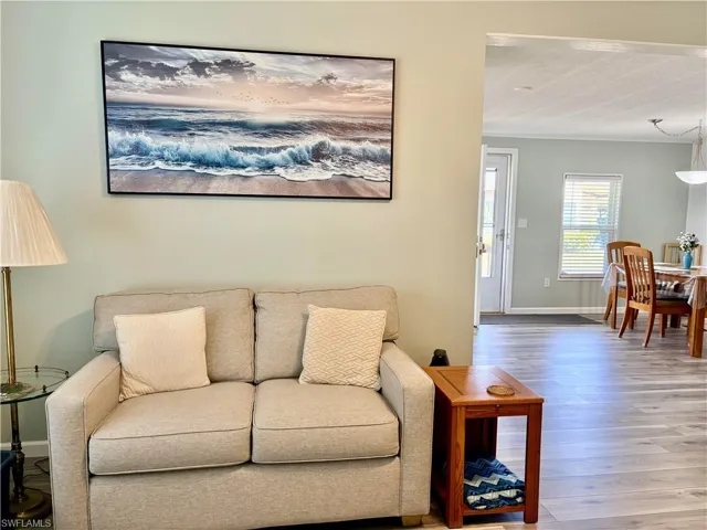 Living area featuring wood finished floors and baseboards