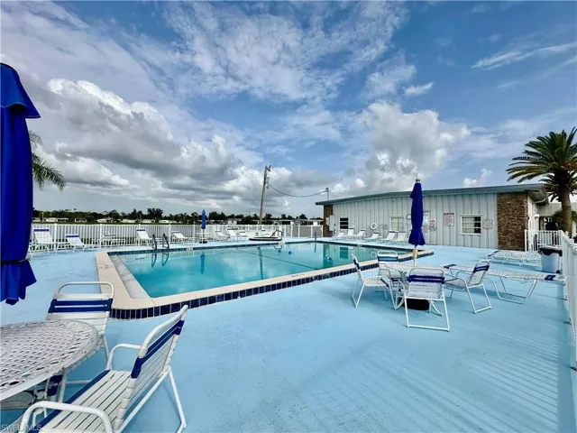 Community pool featuring a patio