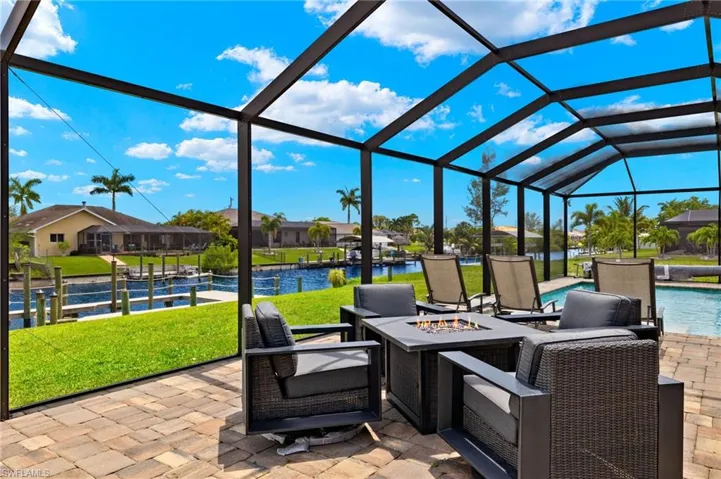 Sunroom featuring a water view