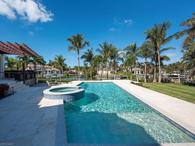 View of swimming pool with an in ground hot tub, a yard, a pergola, and a patio area