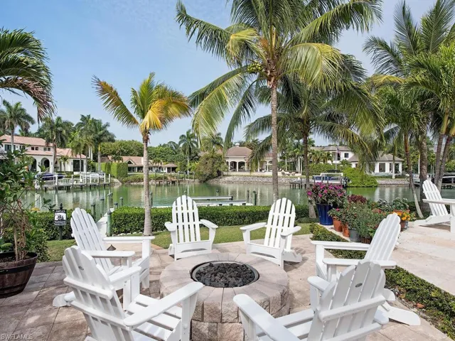 View of patio featuring a water view and a fire pit