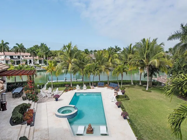 View of pool featuring a lawn, a pergola, an in ground hot tub, a water view, and a patio