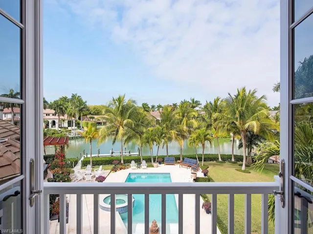 Balcony featuring outdoor lounge area and a water view