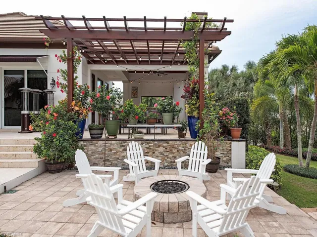 View of patio with a pergola and an outdoor fire pit