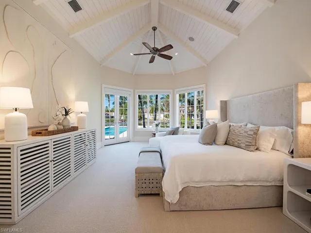 Carpeted bedroom with access to outside, ceiling fan, high vaulted ceiling, and beam ceiling