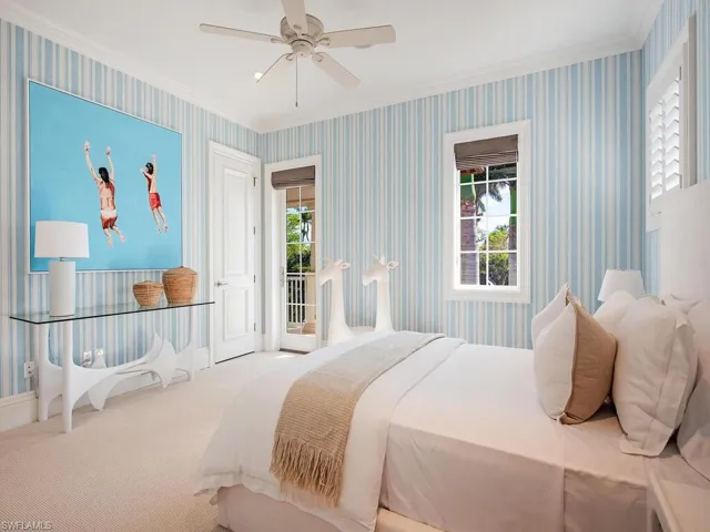 Bedroom featuring ceiling fan, light colored carpet, crown molding, and access to outside