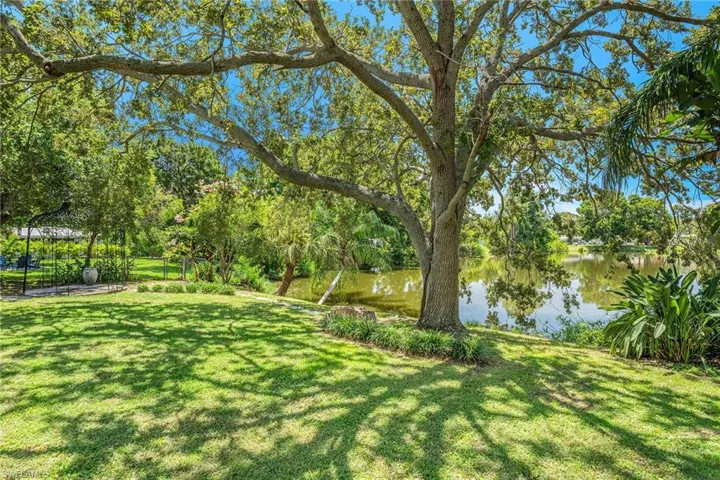 View of yard with a water view