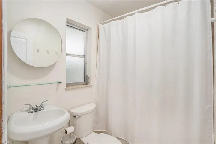 Bathroom featuring sink and toilet