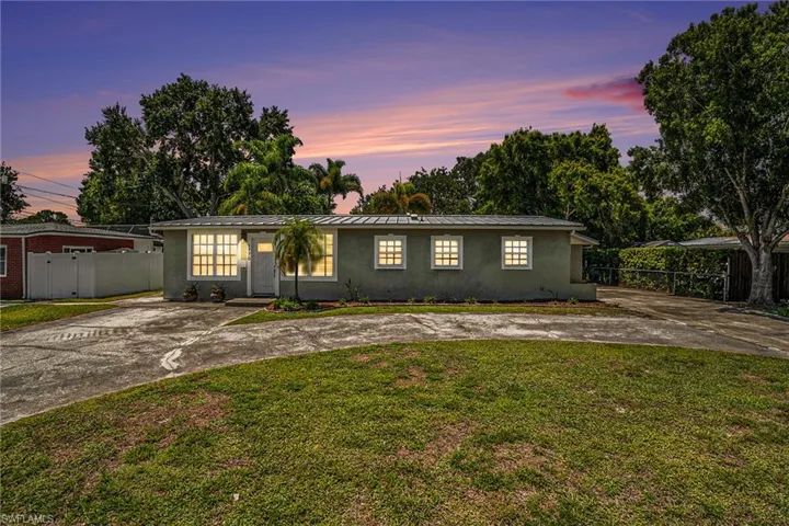 Ranch-style house featuring a yard