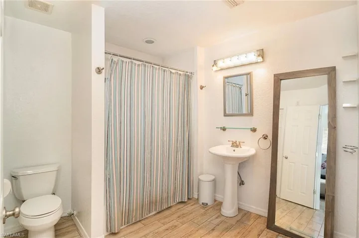 Bathroom featuring toilet and sink