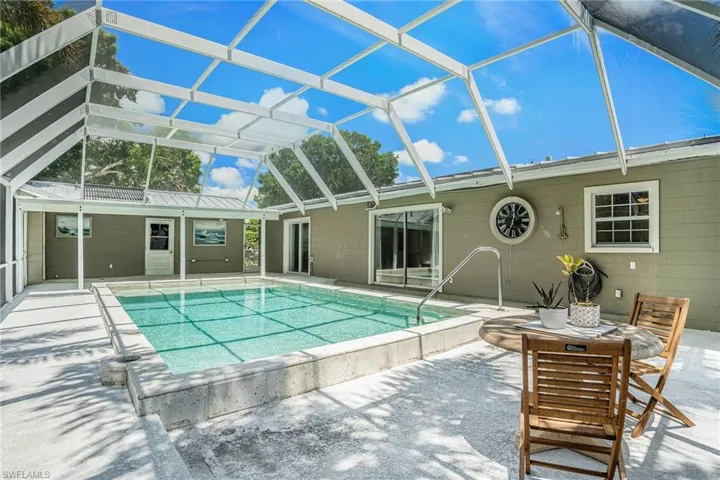 View of pool featuring a lanai and a patio area