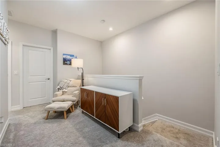 Sitting room featuring recessed lighting, carpet flooring, and baseboards
