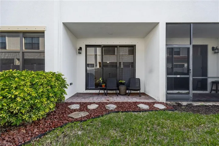 Property entrance with stucco siding