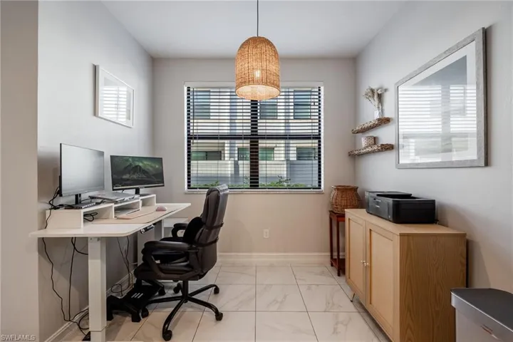 Office space with marble finish floor and baseboards