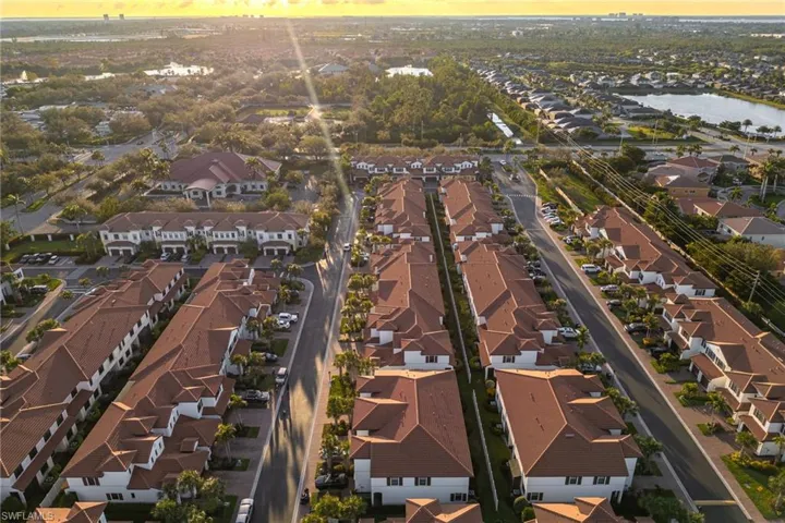 Drone / aerial view featuring a water view and a residential view