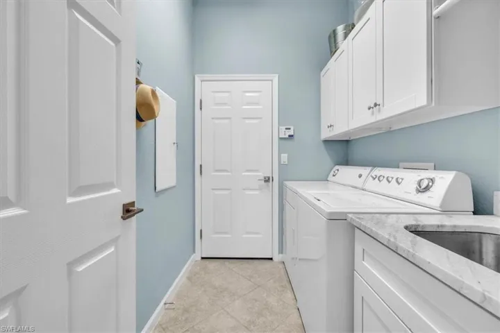 Laundry with full size Washer and Dryer.