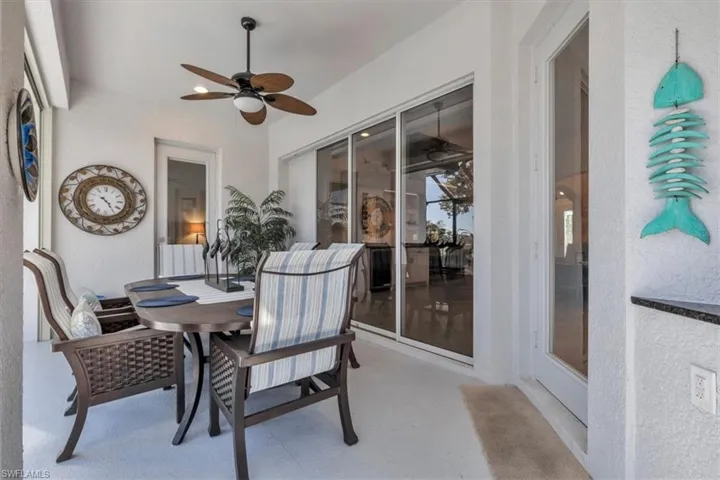Covered patio featuring a ceiling fan, recessed lighting, sliding glass door.