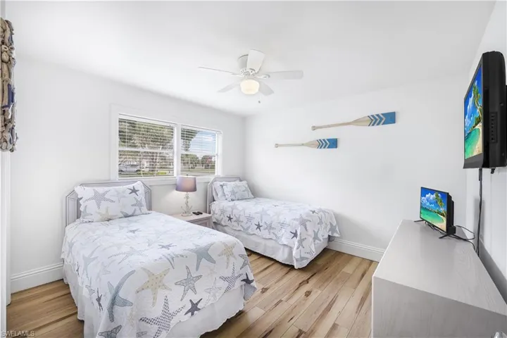 Bedroom featuring a ceiling fan and light wood-type flooring