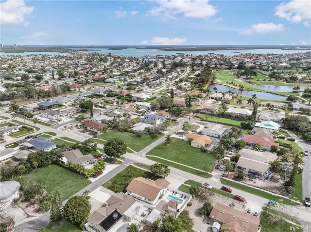 View of property location with nearby suburban area and a large body of water