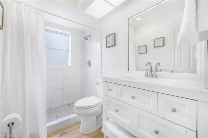 Bathroom with vanity and a stall shower