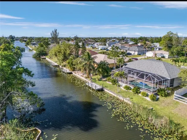 Bird's eye view with a water view and a residential view
