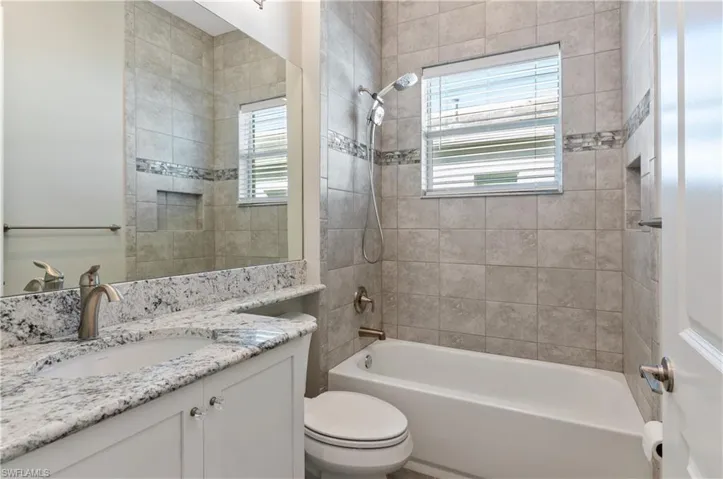 Full bathroom featuring tiled shower / bath
