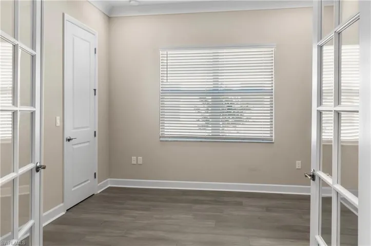 Den/Office with french doors and wood flooring