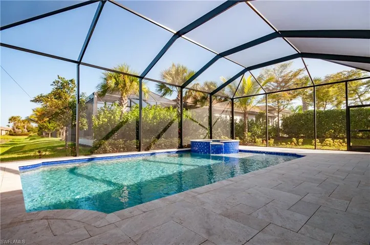 Swimming pool with an in ground hot tub and large lanai area