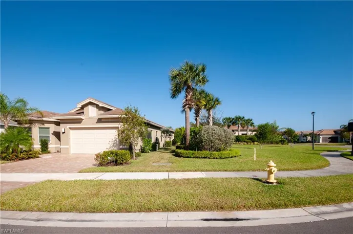 View of front with large side yard