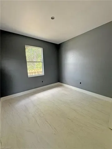 Empty room with baseboards