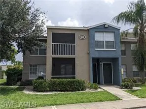 View of front of house featuring a front yard and stucco siding