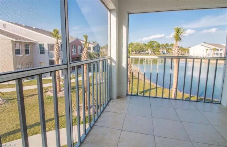 Balcony with a water view and a residential view