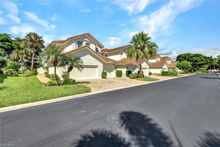 Street view of the end unit condo with 2 car garage