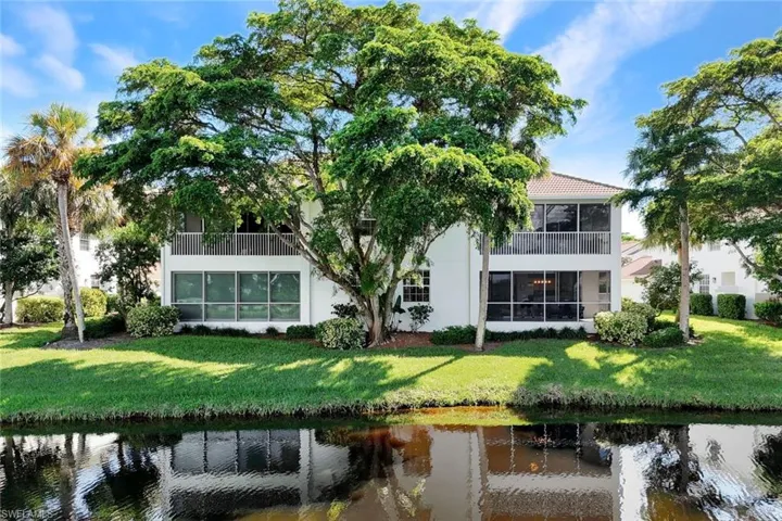 Rear view of Condo with screened in Lanai and waterfront view