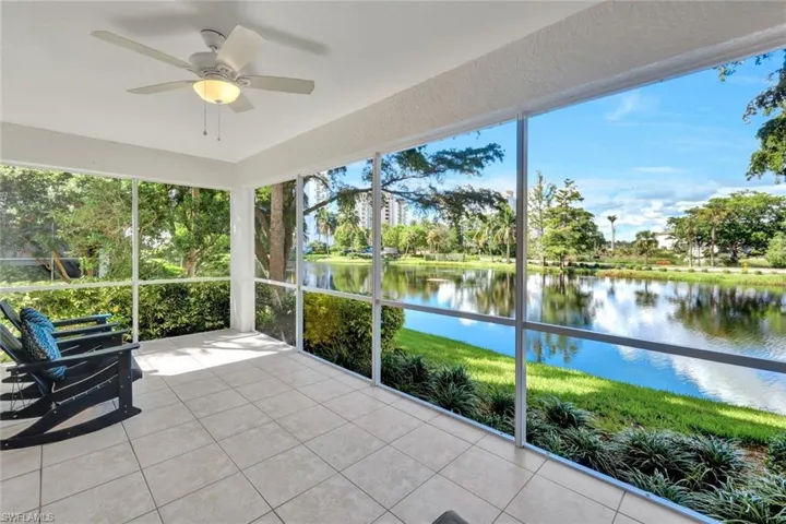 Screened Lanai looking West featuring a water view and a ceiling fan