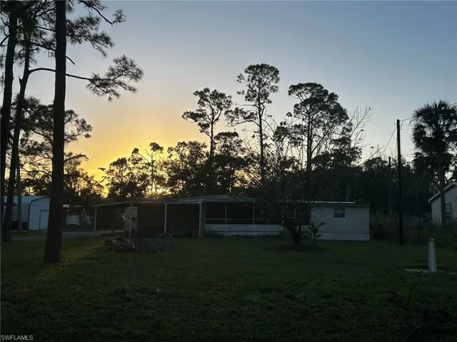 View of yard at dusk