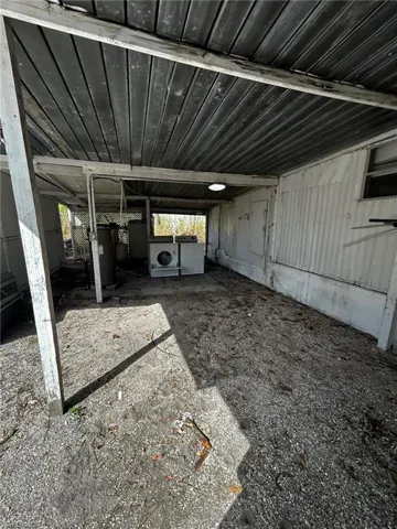 Garage featuring washer / dryer and gas water heater