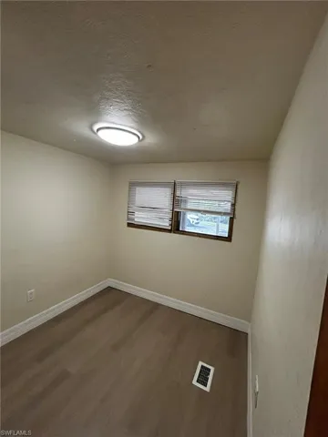 Spare room featuring hardwood / wood-style floors