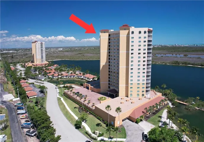 Aerial view of a nearby body of water and apartment complex