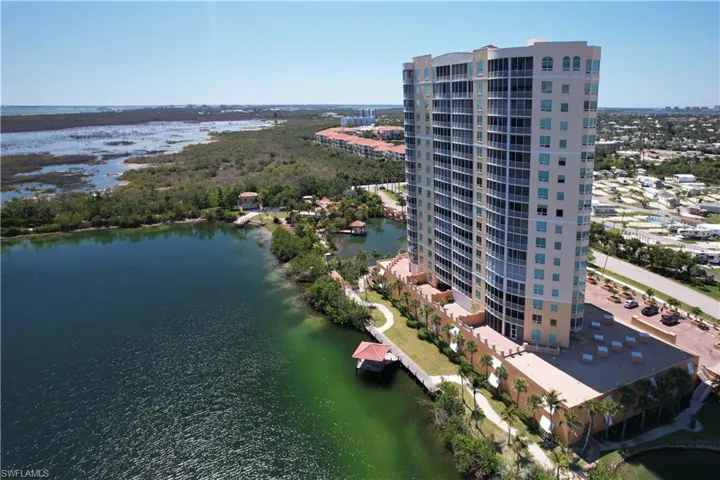 Bird's eye view of apartment complex and a large body of water