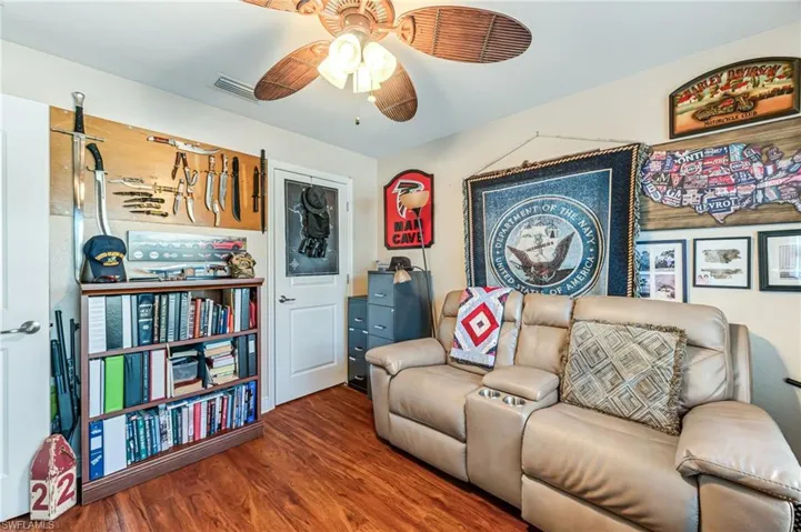Living room featuring hardwood / wood-style floors and ceiling fan