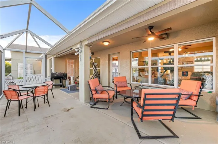 View of patio / terrace with glass enclosure and ceiling fan