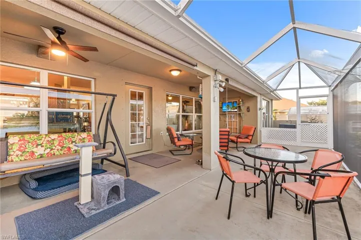 View of patio / terrace with glass enclosure and ceiling fan