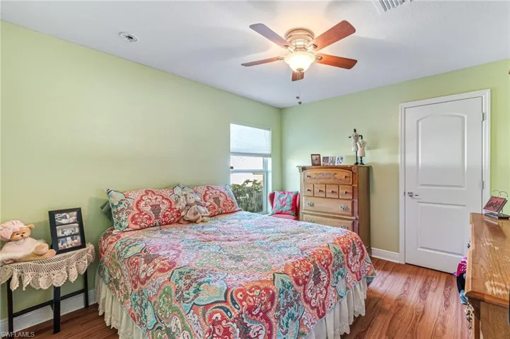 Bedroom featuring hardwood / wood-style floors and ceiling fan