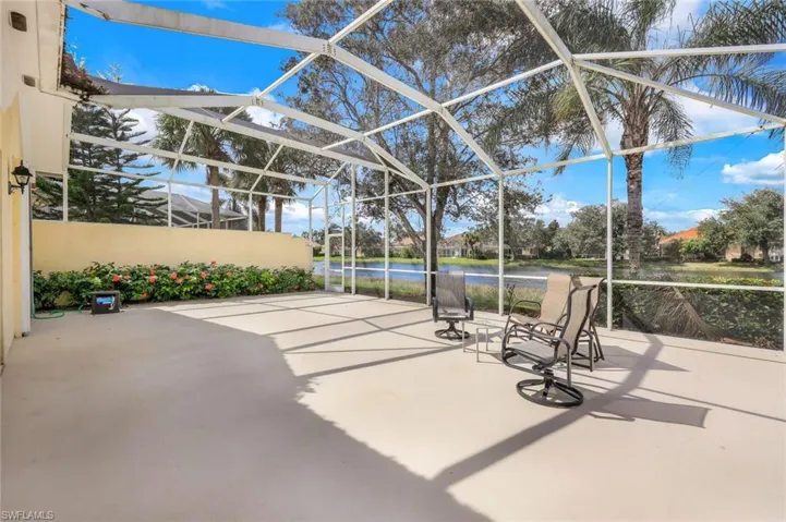 View of patio with a lanai