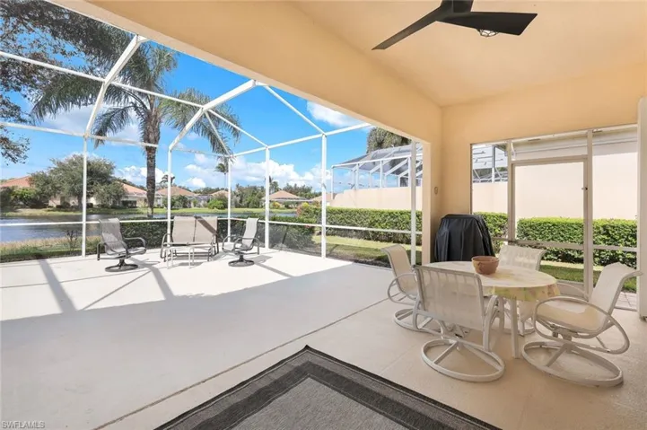 View of patio / terrace with ceiling fan and glass enclosure