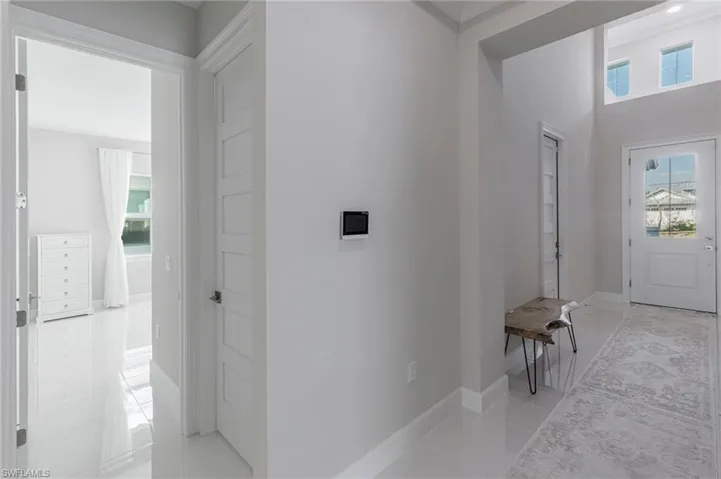 Entrance foyer featuring light tile patterned floors