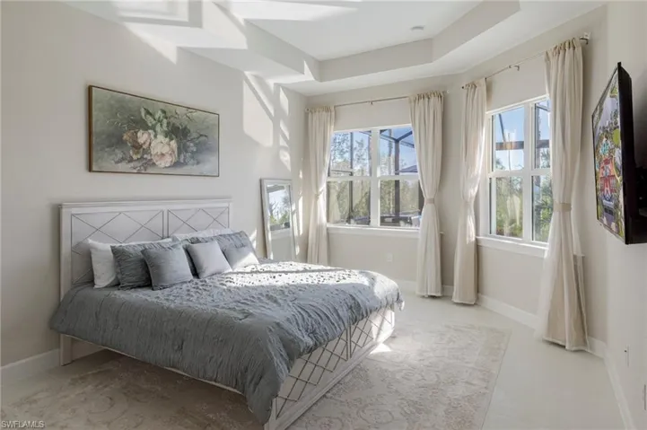 Bedroom featuring multiple windows
