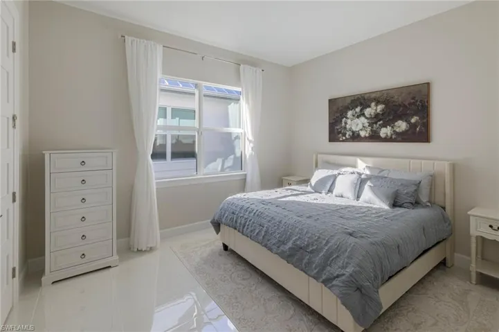 Bedroom featuring light tile patterned floors